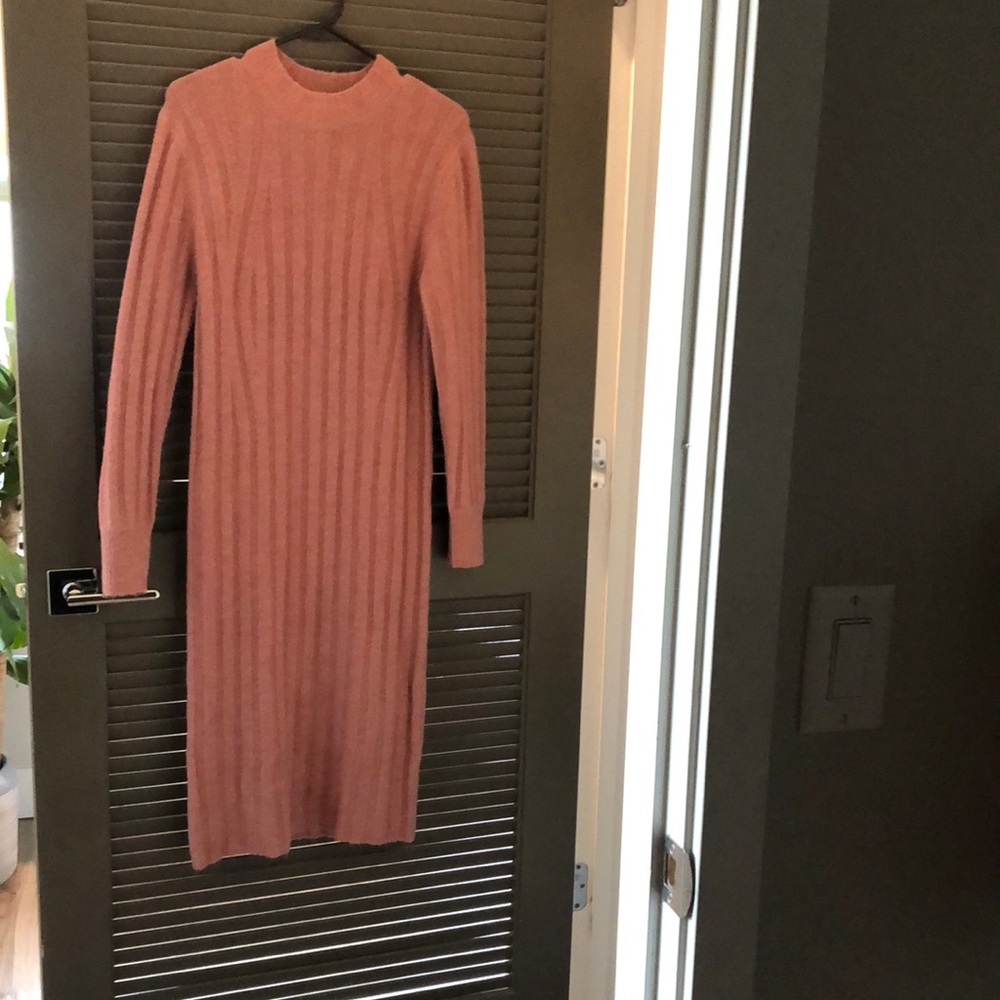 A new day dress sweater in pink women’s size small fairly worn.